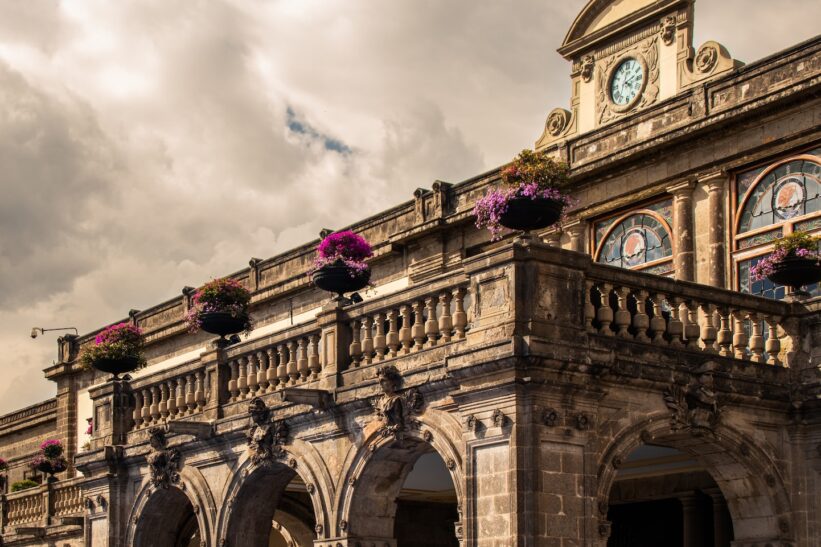 a large building with a clock on the top of it